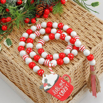 Guirlande de perles de bois avec pompons